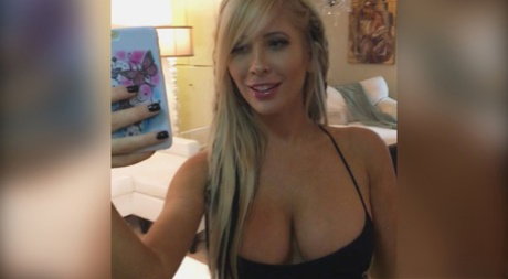 Blonde MILF Tasha Reign shows her bosom and rides a cock on a couch