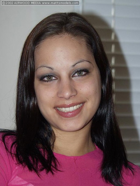 Brunette teen Nicole makes her nude modelling debut on a black leather couch