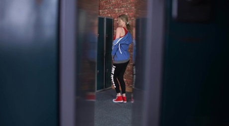 Blonde girl with a tight ass Leah gets naked while being spied upon