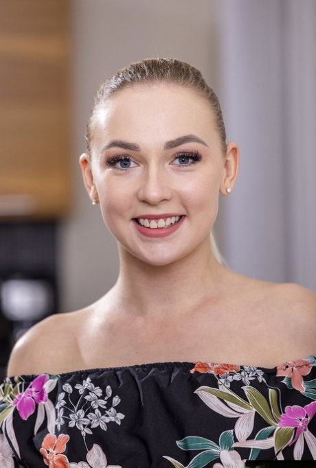 Lovely blonde teen Jenny Wild undresses to show her perfect naked body