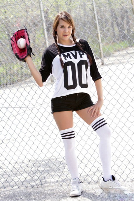 Young girl Andi Land exposes herself while playing ball at a diamond