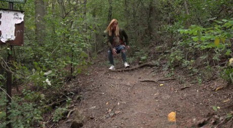 Blonde girl Chrissy Fox gets caught taking a piss while out in the woods