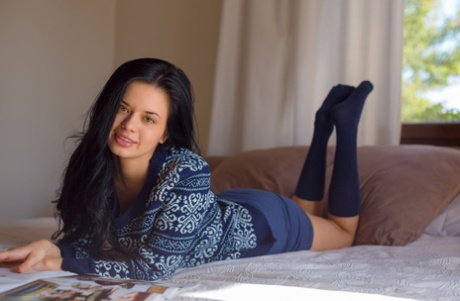 Brunette beauty  Carmen Summer goes barefoot for nude solo poses on her bed