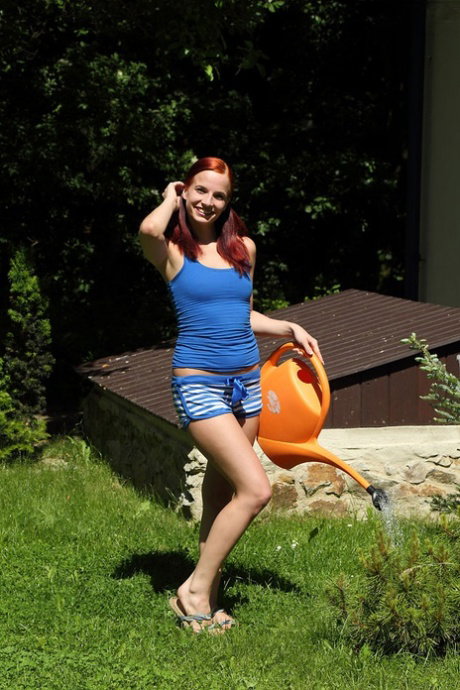 Young redhead Leila Smith receives a vaginal insertion from her lesbian lover