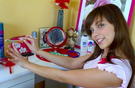 Cute teen Carla Jessi finger spreads her pussy before masturbating with a toy