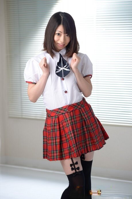 Japanese coed Amina Kiuchi gets nearly totally naked on top of her bed