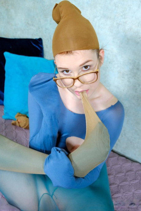 Nerdy redhead Kaira Love models in revealing hose with her glasses on