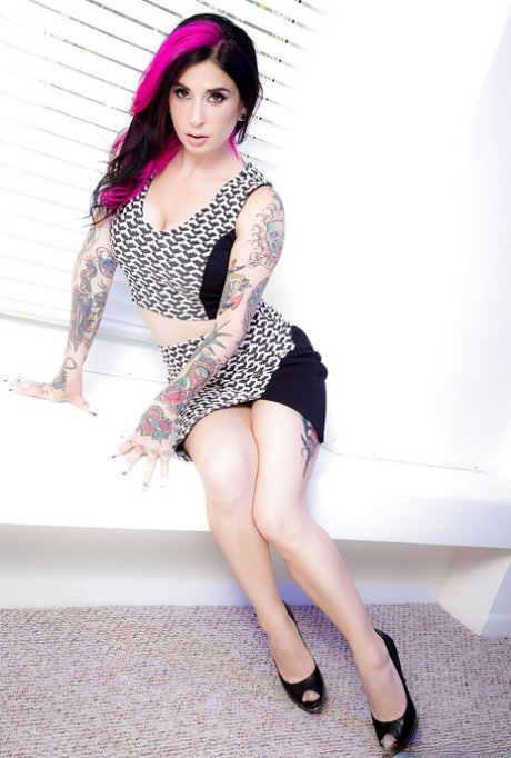 Alternative chick Joanna Angel posing fully clothed in high heels