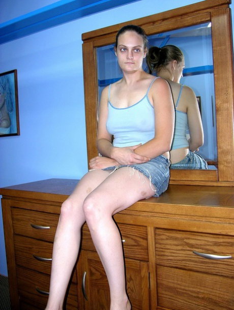 Amateur American babe Danni rubs her pussy and teases with her big tits