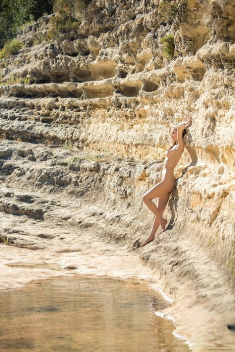 Centerfold babe in a sexy bikini Miss Zita flaunting her fake tits outdoors