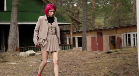 Vasya pulls down her panties while taking an outdoor piss in a miniskirt