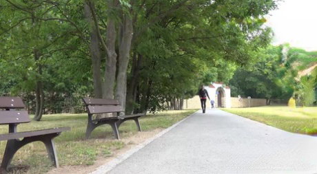 White girl Victoria Daniels takes a piss next to a bench in a public park