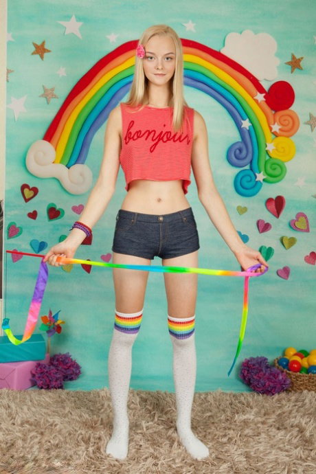 Tall teen with blonde hair Natasha rolls off OTK socks to pose totally naked