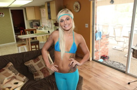 Tattooed blonde in blue sheer pantyhose getting her bald pussy covered in cum