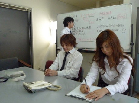 Japanese office babe Rina Kikukawa participates in a blowbang at work
