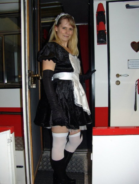 Blonde maid Sweet Susi takes off her uniform while inside a motorhome