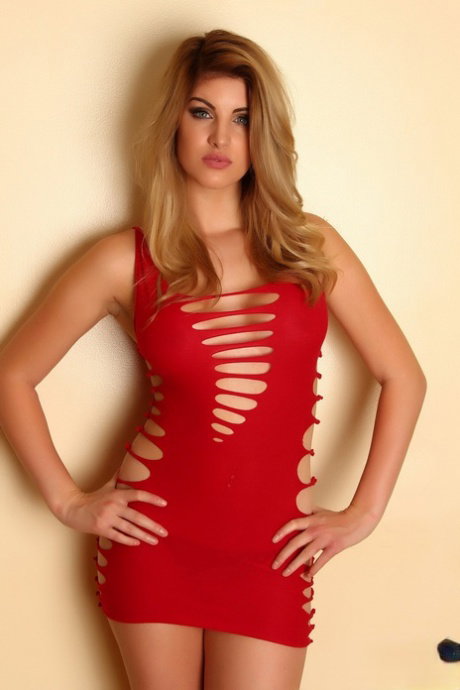Hot solo model Arielle strikes alluring non nude poses in a red dress