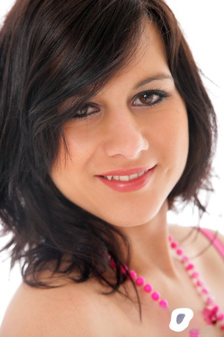 Dark haired teen Megan tidies up her hairy pussy with a shave