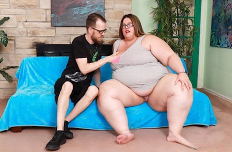 SSBBW Erin Green wears glasses and lipstick during a hardcore fuck