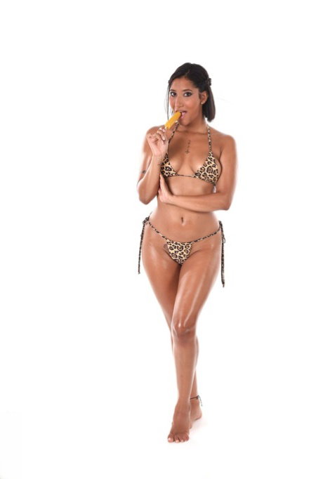 Sexy brunette Alika Penagos takes off her bikini while eating a popsicle