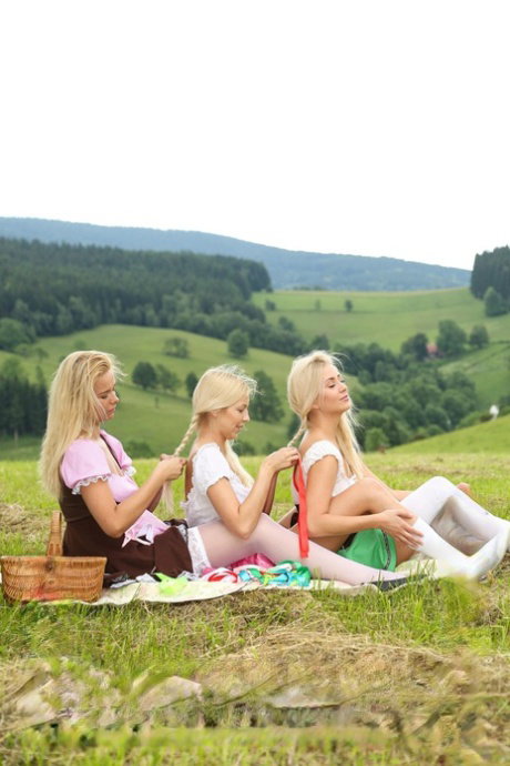 Young Czech beauties show their attributes and play with toys outdoors