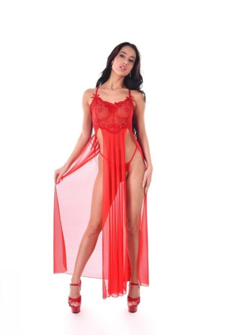 Skinny brunette Kama Oxi masturbates with a vibrator in red heels