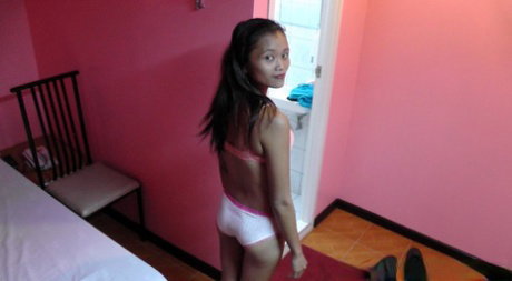 Young Pinay girl Miriam takes a cumshot in tits after sex with a tourist