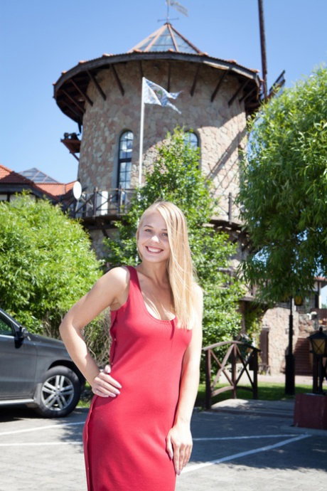 Beautiful blonde Sarika A flashes public upskirt before posing naked indoors