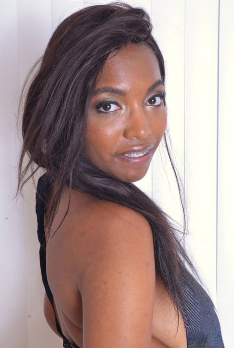 Ebony amateur Daya Knight slips fingers inside labia lips to reveal pink twat