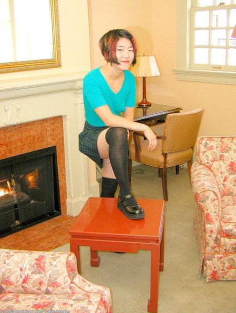 Amateur Asian in over the knee nylons sheds panties to expose hairy pussy