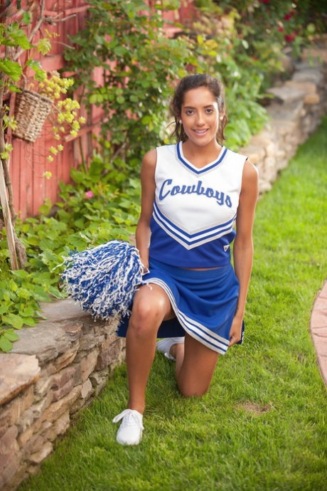 Brunette cheerleader Chloe Amour bares her hot body & fingers her ass outdoors