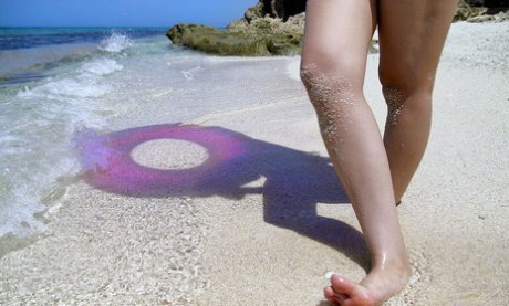Japanese model Nao Yoshizaki goes skinny dipping while hanging at the beach