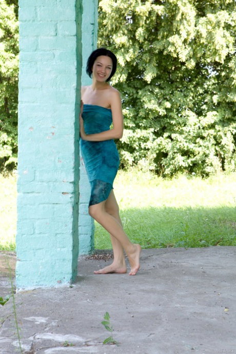 Beautiful brunette Loreen A gets totally naked while in a forest