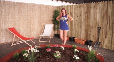 Redheaded British plumper covers her naked pussy with her hands