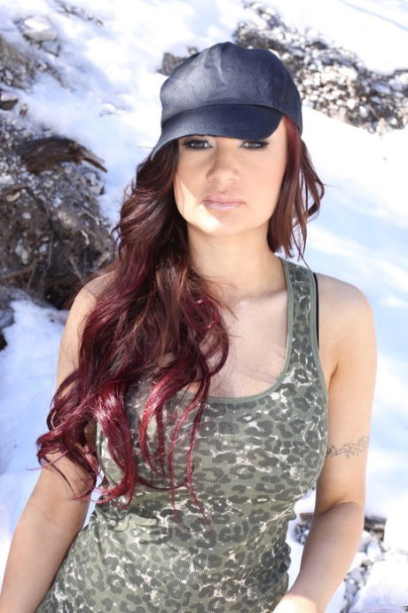 Sexy German redhead Amy Ried stripping down naked in the nature