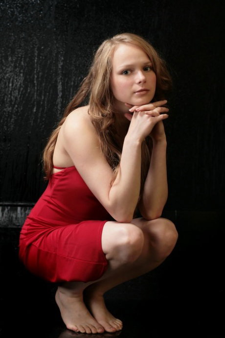 Nice teen Mia C frees her perky tits and bald slit from a red dress