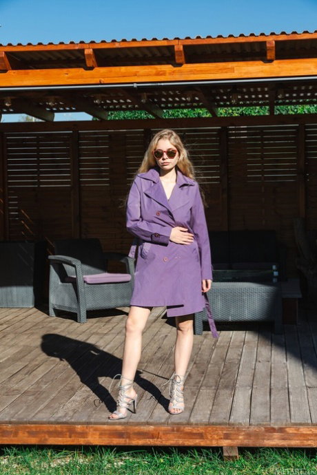Blonde teen Mila Amour takes off her shades while going nude in heels
