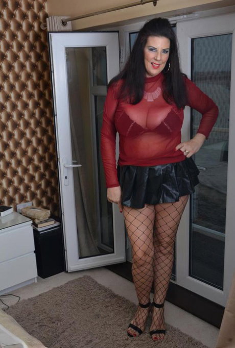 UK brunette Lu Lu Lush exposes her pussy in fishnet hose during upskirt action