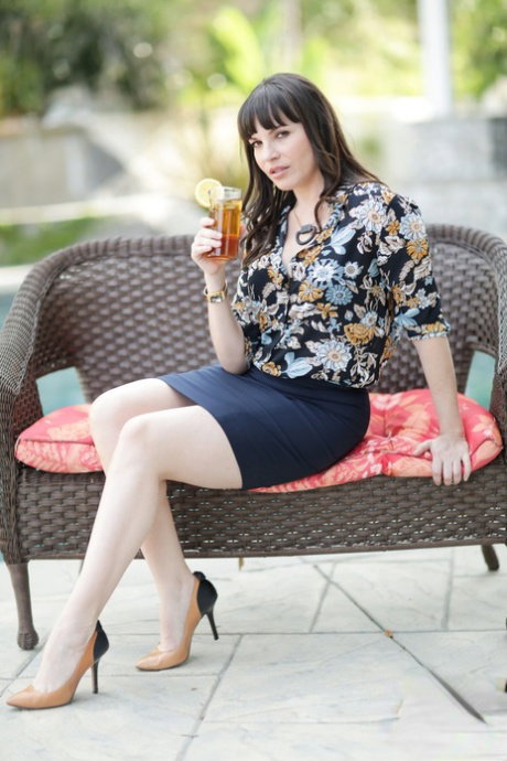 Gorgeous brunette MILF Dana DeArmond reveals her perfect ass on the patio