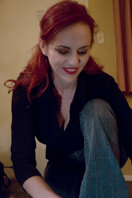 Busty redhead Claire Adams treats a hung stud to a satisfying titjob