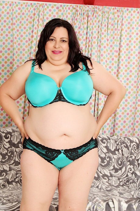 SSBBW Lacy Bangs gets naked on a futon in heels before giving head