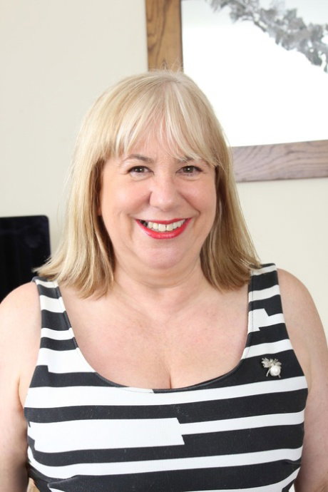 Blonde mature Auntie Trisha strips to lingerie and fucks a skinny guy