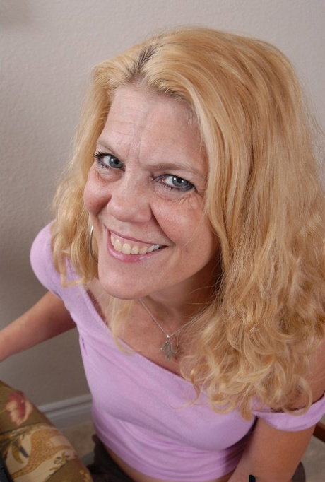 Sexy mature blonde Lori gets naked in the kitchen in close-up scene