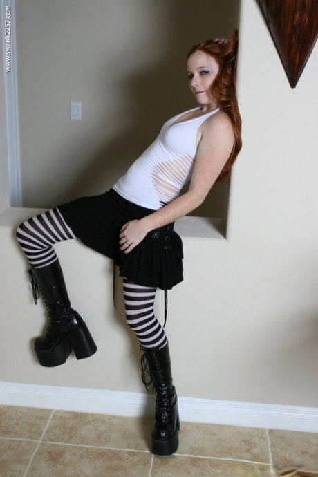 Alluring babe Gypsy shows her yummy pussy while taesing in boots & stockings