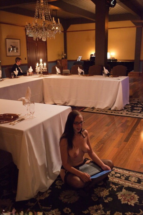 Blonde slave is subjected to a painful BDSM scene in front of a dinner party