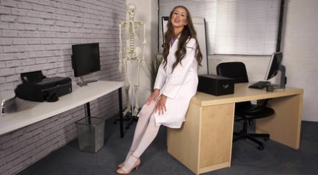 Beautiful chick Jemma strips to a garter belt and nylons while at work