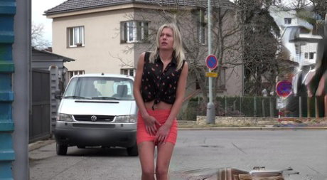 Blonde girl Claudia Macc hikes up her miniskirt to piss beside the road