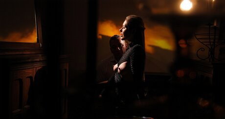 Hot redhead undoes her sparkly dress while having sex in candlelight