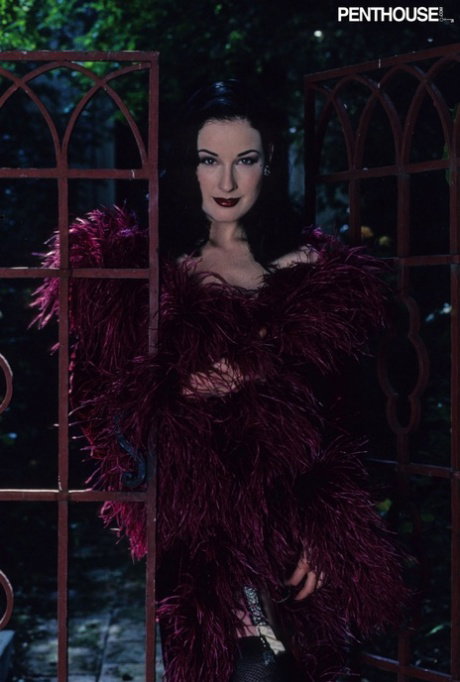 Babe with big tits Dita Von Teese teases in nylons & fingers herself outdoors