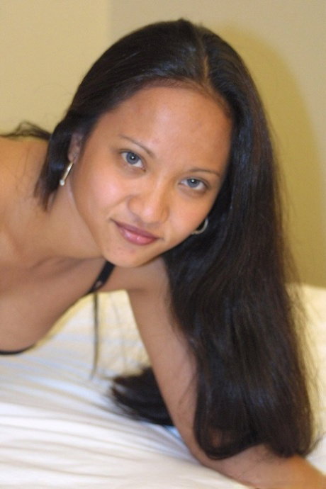 Big-breasted Asian babe Loni Camp enjoys some doggystyle sex & takes a facial